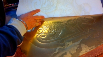 ...copying the design directly onto the sheet of brass...